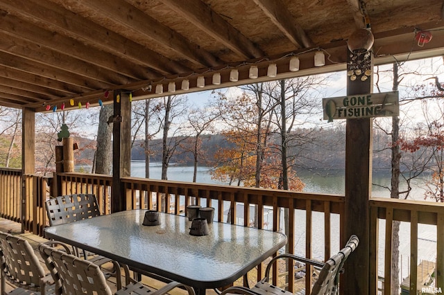 wooden deck with a water view