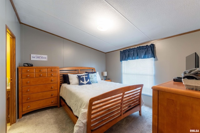 carpeted bedroom featuring crown molding, lofted ceiling, and a textured ceiling