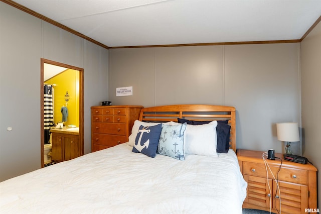 bedroom featuring connected bathroom and crown molding