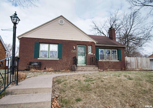 bungalow-style house featuring a front yard