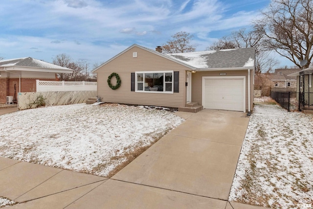 ranch-style house featuring a garage