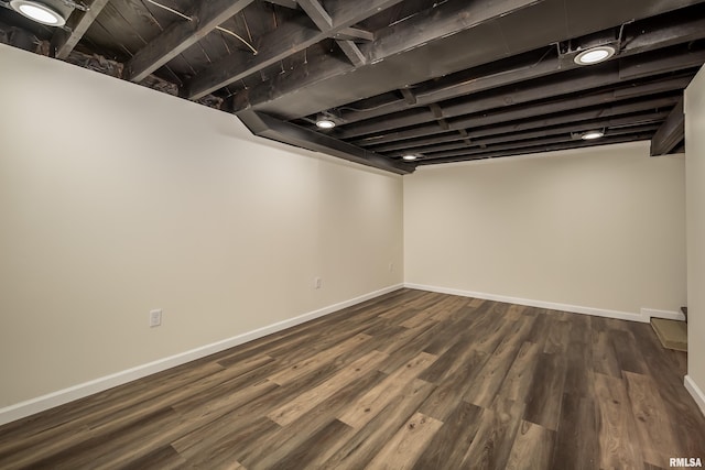 basement featuring dark wood-type flooring