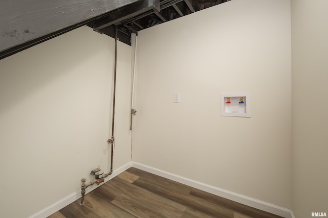 laundry area featuring dark hardwood / wood-style flooring and hookup for a washing machine