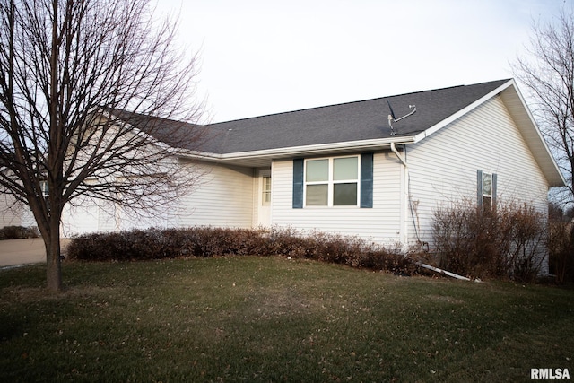 view of property exterior with a lawn