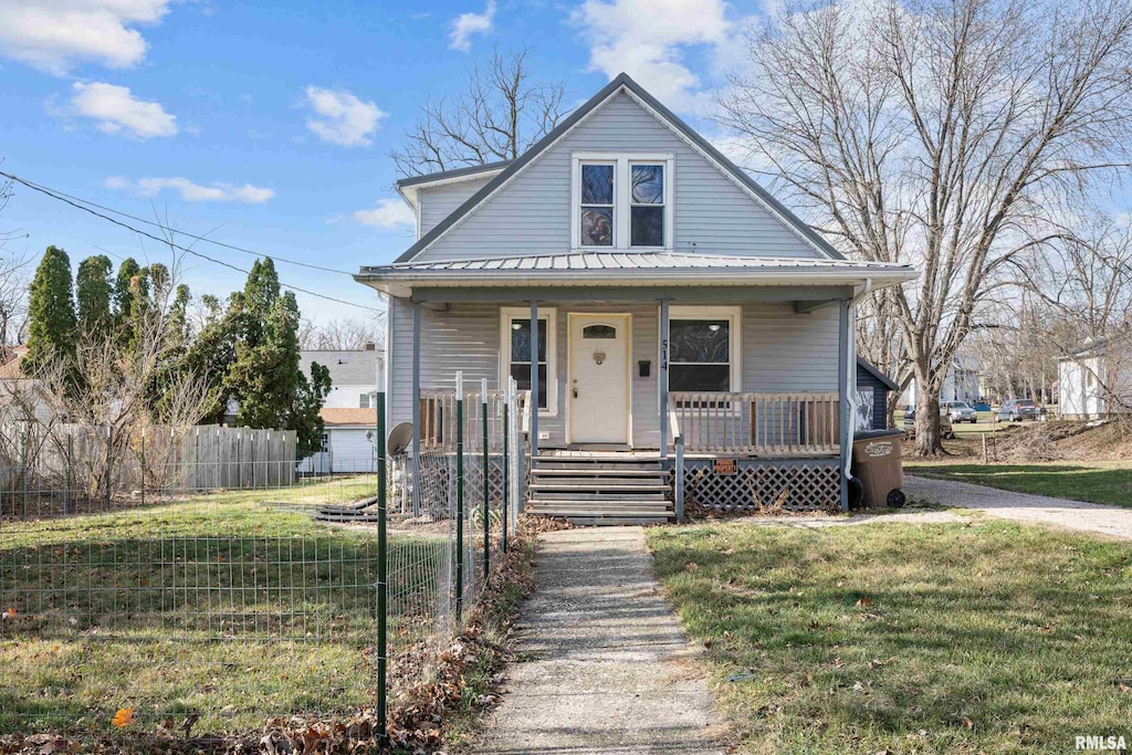 bungalow-style home with a front lawn and covered porch