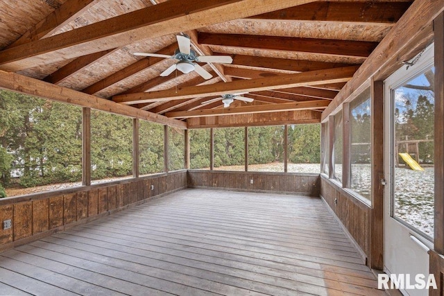 unfurnished sunroom featuring vaulted ceiling with beams and ceiling fan