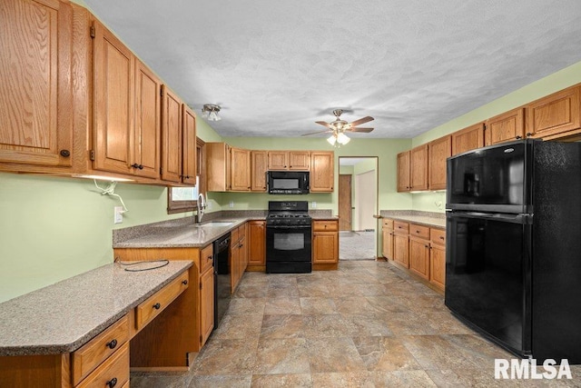 kitchen with ceiling fan, sink, black appliances, and a textured ceiling