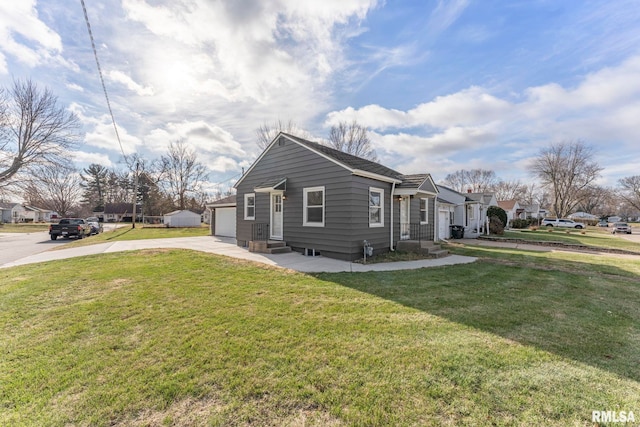 view of side of home featuring a yard and a garage