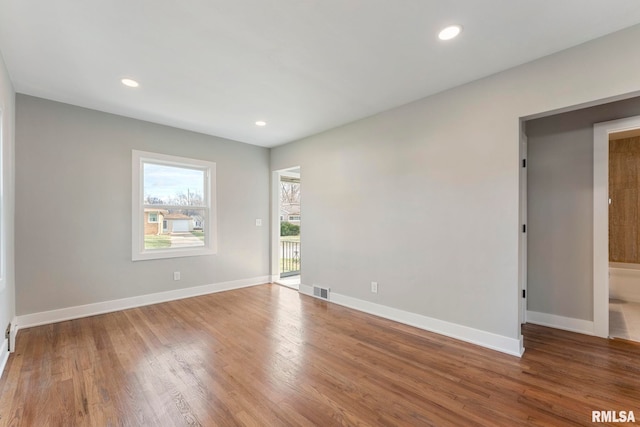 unfurnished room featuring wood-type flooring