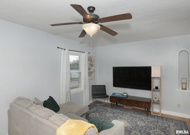 living room with ceiling fan and hardwood / wood-style floors