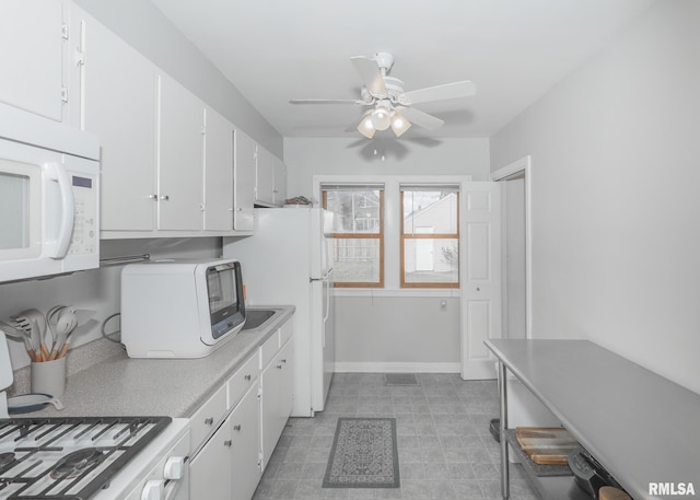 kitchen featuring ceiling fan, white appliances, and white cabinetry