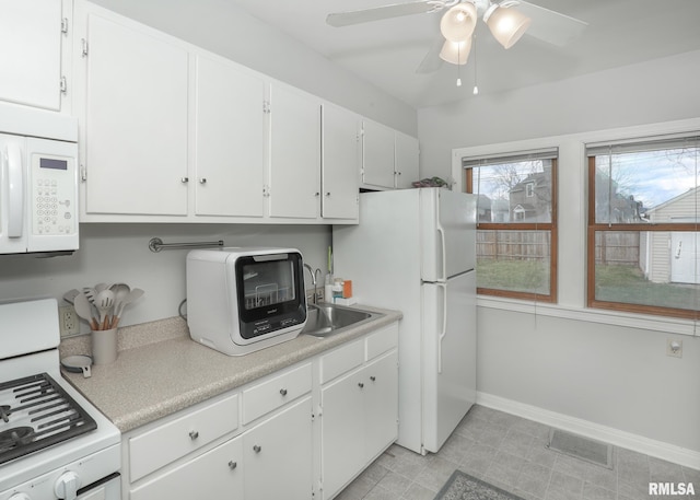 kitchen with ceiling fan, white cabinetry, white appliances, and sink