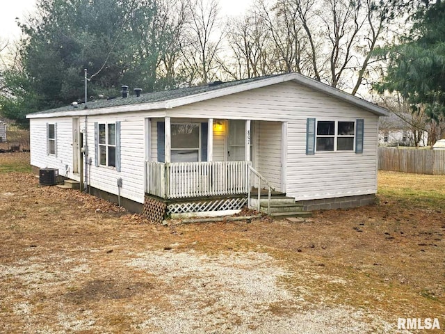 manufactured / mobile home with central AC unit and a porch