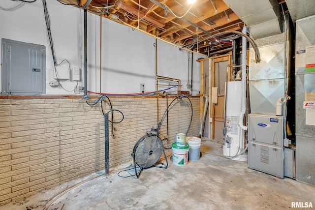 utility room with electric panel, heating unit, and water heater