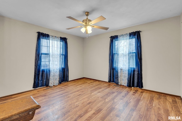 spare room featuring ceiling fan and wood-type flooring