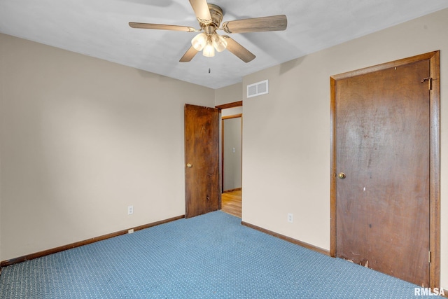 unfurnished bedroom featuring ceiling fan and light colored carpet