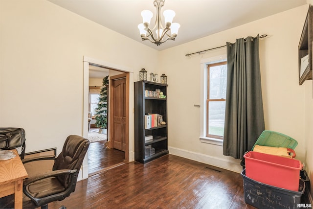 office featuring dark hardwood / wood-style flooring and an inviting chandelier