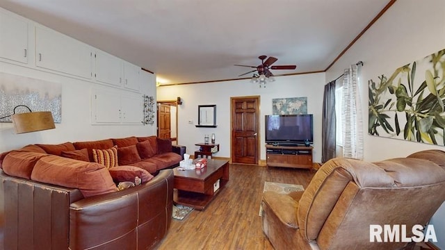 living room with crown molding, light hardwood / wood-style flooring, and ceiling fan