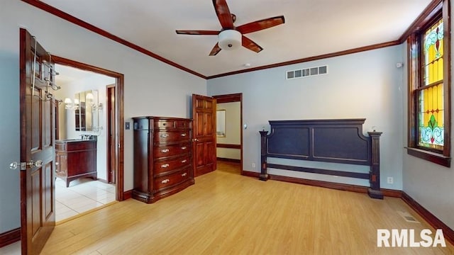 bedroom with ceiling fan, crown molding, and light hardwood / wood-style floors