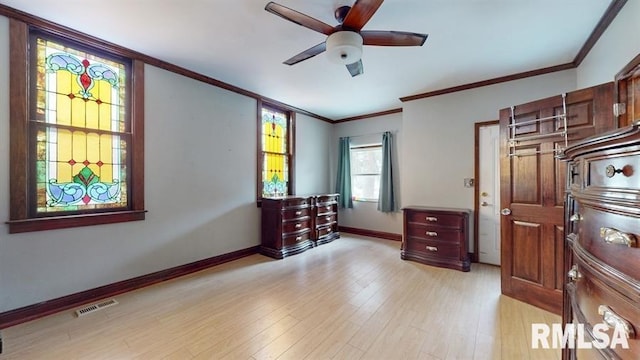 bedroom featuring ceiling fan, light hardwood / wood-style flooring, and crown molding