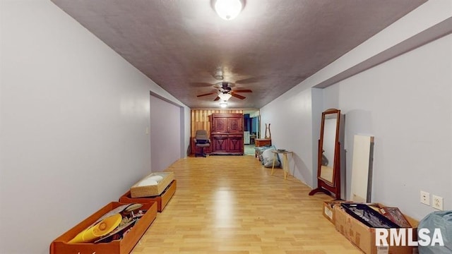 hallway with light hardwood / wood-style flooring