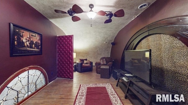 interior space featuring ceiling fan and wood-type flooring