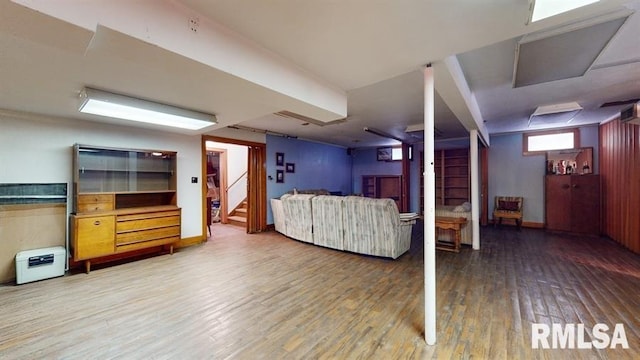 unfurnished living room featuring hardwood / wood-style floors