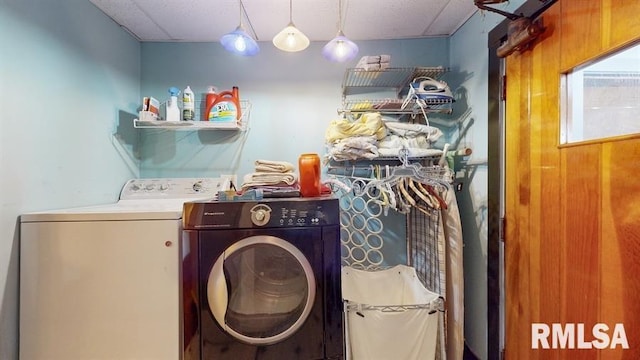 laundry area featuring washing machine and clothes dryer