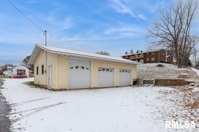 view of snow covered garage