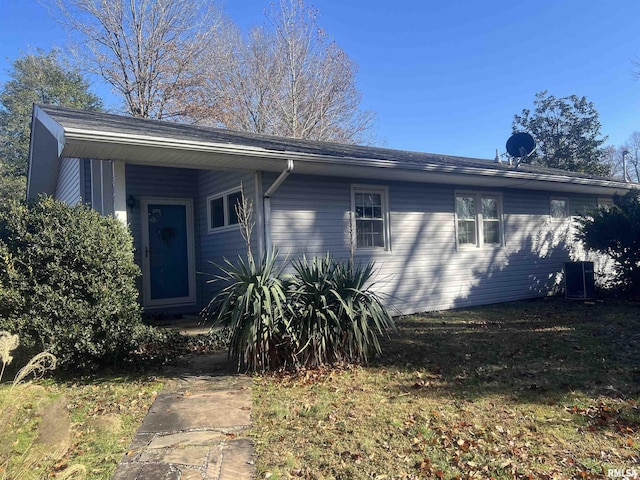 single story home featuring central AC unit