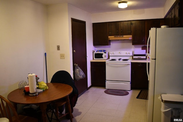 kitchen with white appliances and dark brown cabinetry