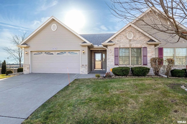 view of front of house with a garage and a front yard