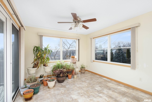 sunroom / solarium with ceiling fan