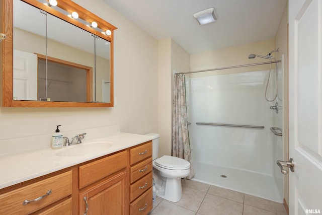 bathroom with curtained shower, tile patterned flooring, vanity, and toilet