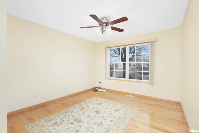 unfurnished room featuring ceiling fan and light wood-type flooring