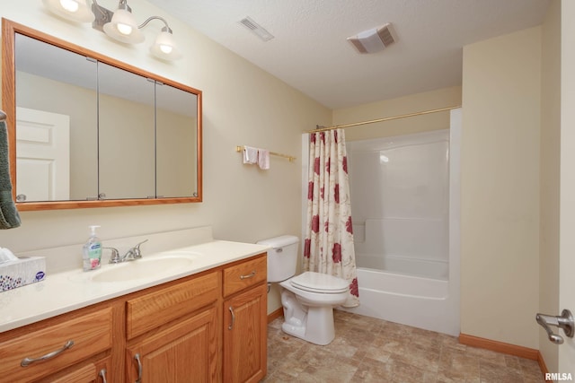 full bathroom featuring vanity, toilet, shower / bath combo with shower curtain, and a textured ceiling