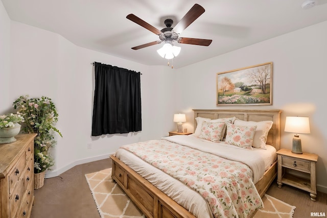 bedroom with ceiling fan and light carpet