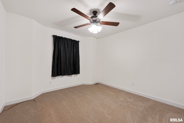 empty room featuring light carpet and ceiling fan