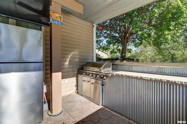 view of patio / terrace featuring area for grilling and exterior kitchen