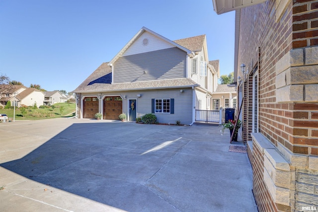 view of front of property with a garage