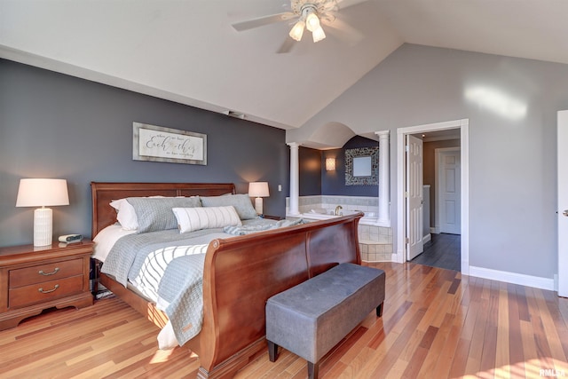 bedroom with ornate columns, ceiling fan, vaulted ceiling, and hardwood / wood-style flooring