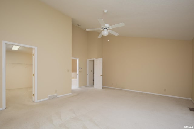 interior space with high vaulted ceiling and ceiling fan