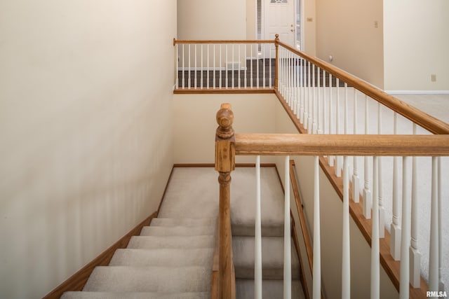 stairs with carpet flooring