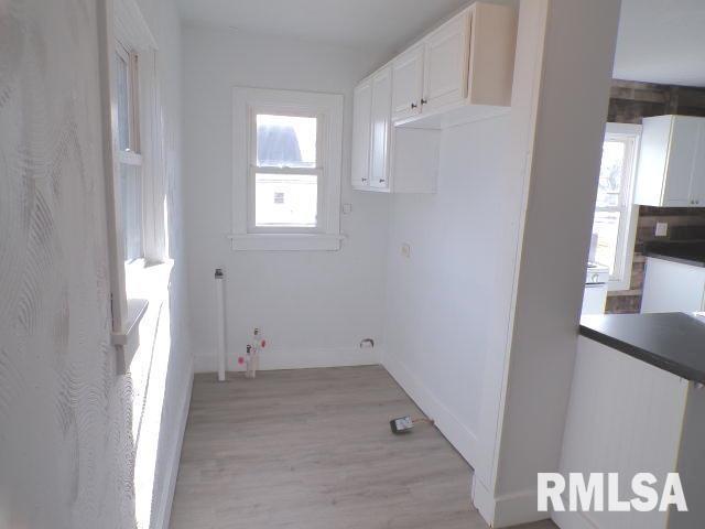 laundry room featuring light hardwood / wood-style flooring