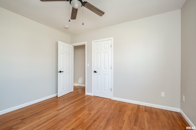 empty room featuring ceiling fan and wood-type flooring