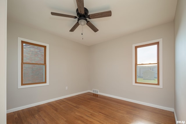 unfurnished room with light hardwood / wood-style flooring and ceiling fan