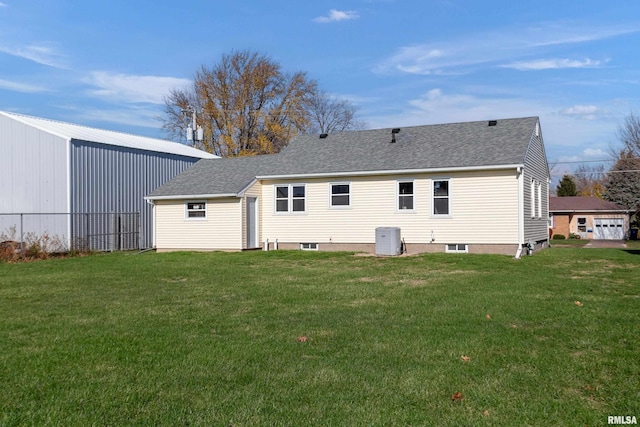 back of property featuring cooling unit and a lawn