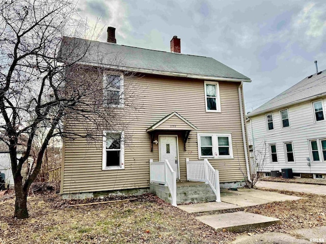 view of front of home featuring cooling unit