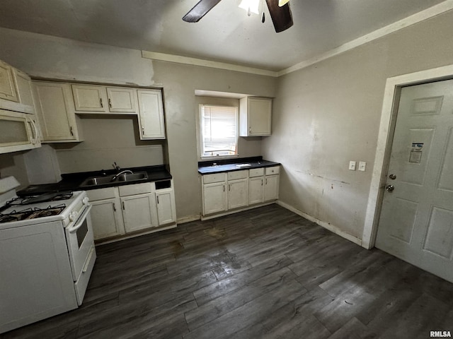 kitchen featuring dark hardwood / wood-style flooring, white appliances, ceiling fan, crown molding, and sink