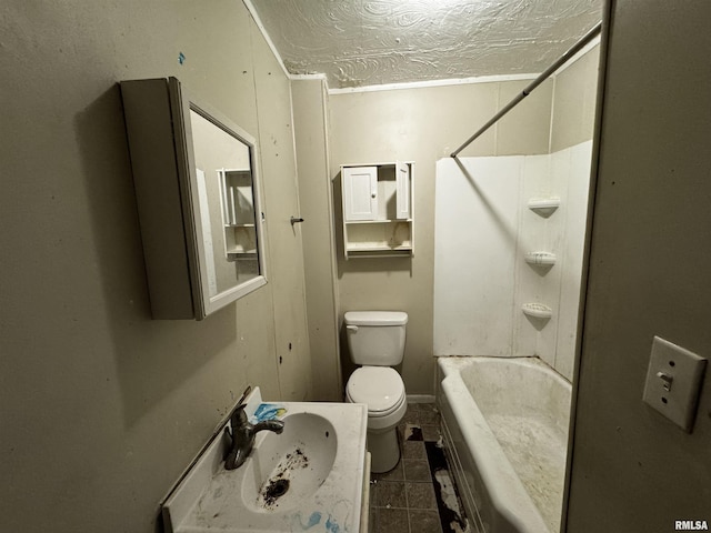 bathroom with a textured ceiling, toilet, and sink